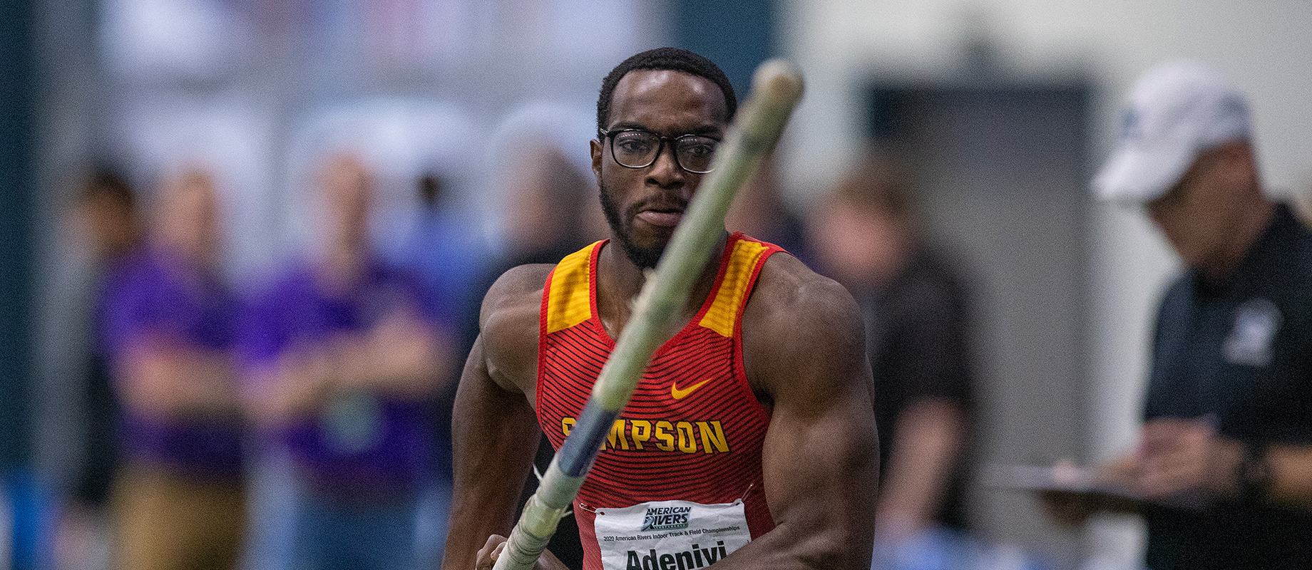 Simpson College's Sam Adeniyi competes in the pole vault