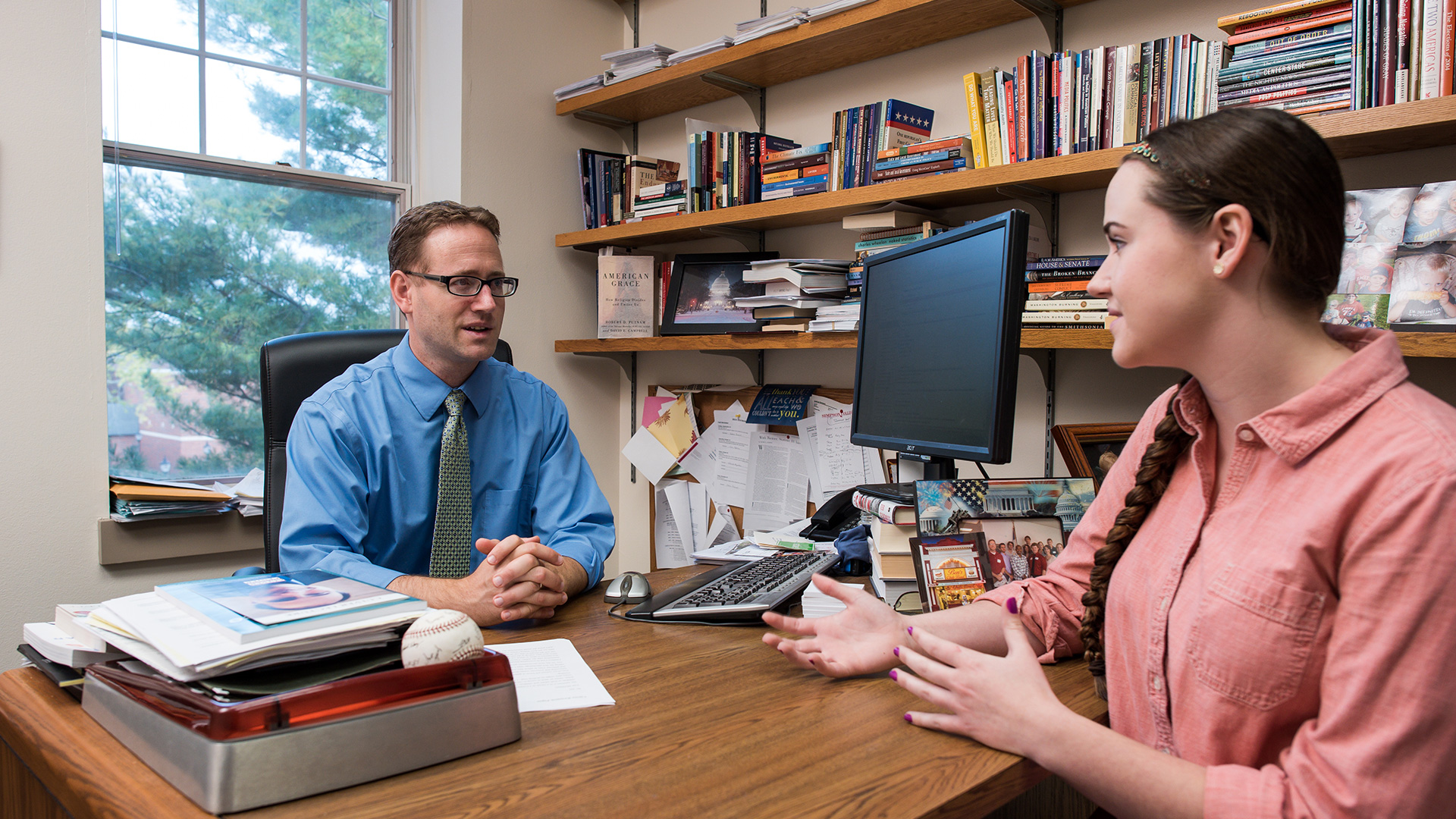 Simpson College professor Kedron Bardwell consults a student